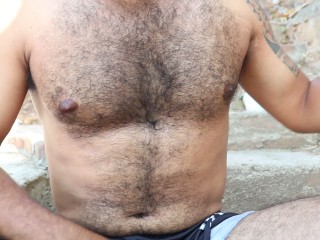 Hairy Latino man strips naked in his neighbor's yard and shows her his dick