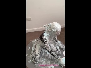 Milf in PVC Catsuit & heels covers her entire body with shaving foam pies