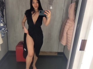 Busty  hot brunette is trying dresses in the store