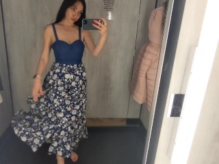 Busty  hot brunette is trying dresses in the store