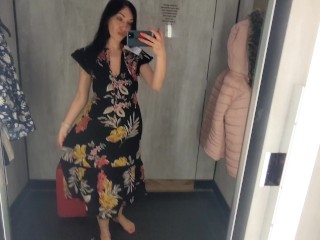 Busty  hot brunette is trying dresses in the store