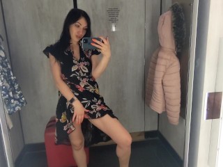 Busty  hot brunette is trying dresses in the store