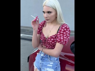 A nice blondie teen is smoking and spitting