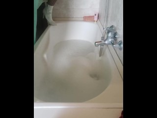 Wet clothes fan request in bathtub with bubbles and soap