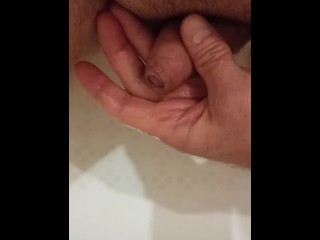 Pissing in the bathroom in my palm and jerking off my dick to the boner.