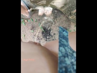 Girl pissed near a big old tree with one leg up