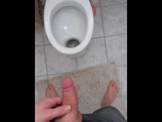 Big and hard cock of a young guy gives out a golden shower in the morning