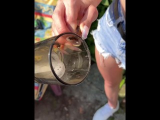 A blondie girl is coughing and hocking a really big loogie spitting it out and showing it