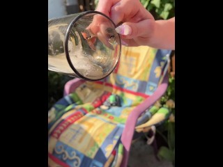 A blondie girl is coughing and hocking a really big loogie spitting it out and showing it