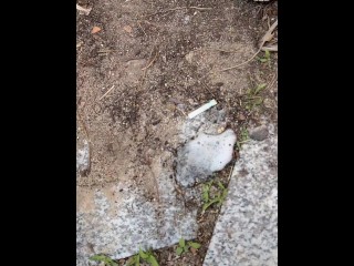 A blondie girl is coughing and hocking a really big loogie spitting it out and showing it