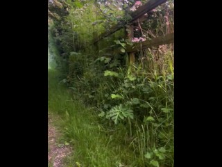 Naked barefoot walk on path at side of road