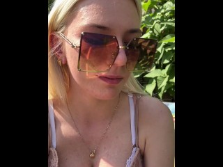 A nice teen is smoking coughing hocking and spitting loogies into a glass