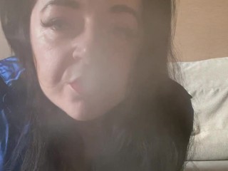 Horny Mistress Lara is smoking and vaping in camera dressed in sexy black corset