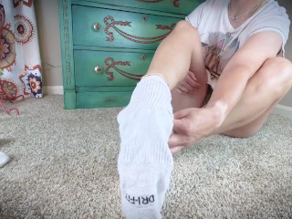 Cute Girl Taking Off Socks