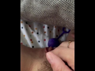 Inserting toy in hairy pussy