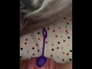 Pushing out toys from hairy pussy