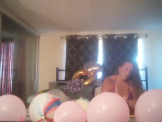 Extremely horny girl takes off her dress and smokes cigarettes and pops balloons naked