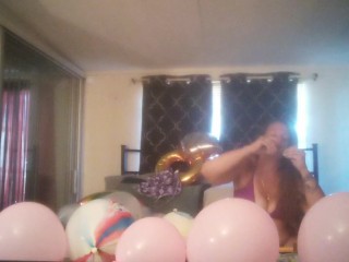 Extremely horny girl takes off her dress and smokes cigarettes and pops balloons naked