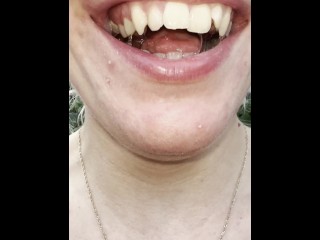 A nice blondie is coughing and spitting close up