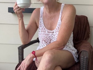 MILF having coffee wearing lace see through beach cover up on hotel balcony and flashing pussy