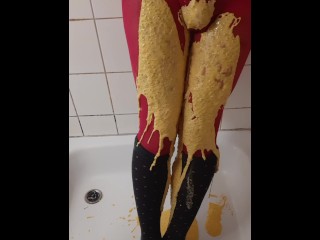 Thick coloured slime on pink pantyhose