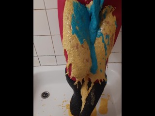 Thick coloured slime on pink pantyhose