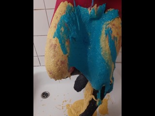 Thick coloured slime on pink pantyhose