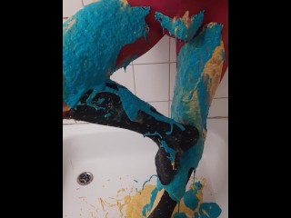 Thick coloured slime on pink pantyhose