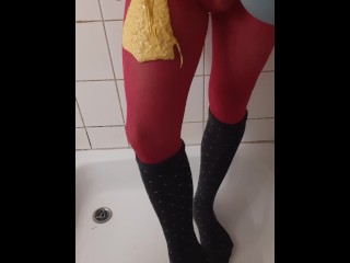 Thick coloured slime on pink pantyhose