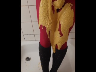 Thick coloured slime on pink pantyhose