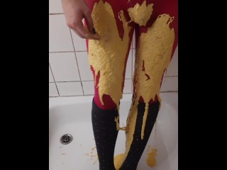 Thick coloured slime on pink pantyhose