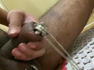 Teasing masturbation with pierced cock and balls