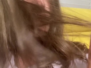 Women let you watch her shiny dark hair and play with them. Close view