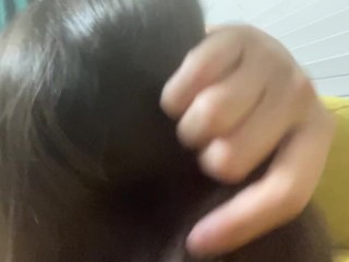 Women let you watch her shiny dark hair and play with them. Close view