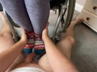 Wheelchair Girl lets foot boy cum on her feet