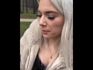 A blondie teen Nina i sitting in the park smoking and spitting making a really big spit puddle