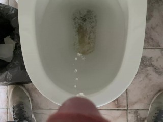 Man pissing in the office toilet, cock view in 4K