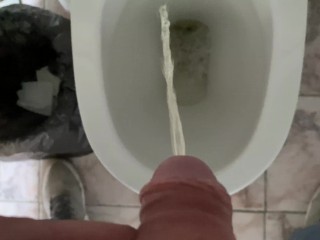 Man pissing in the office toilet, cock view in 4K