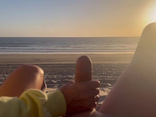 Public handjob. Hand job on a nude beach. We were caught jerking off at sunset near the ocean