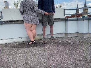 Gorgeous pissing mother-in-law helps son-in-law piss on the top of the parking lot