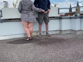 Gorgeous pissing mother-in-law helps son-in-law piss on the top of the parking lot