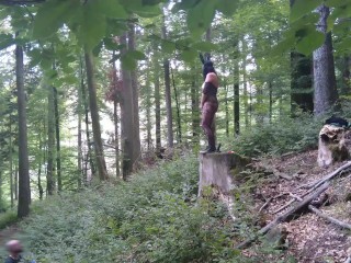 Standing pissing in a woods in a bunny mask and fishnet