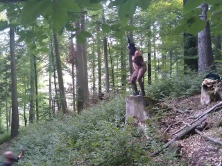 I masturbate and stick a dildo in my pussy while standing on a wooden stump