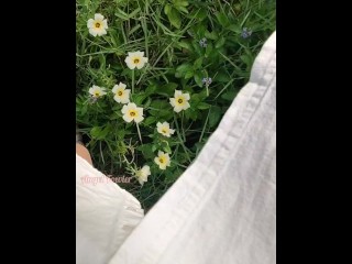 Girl watering Wild Flowers with her Pee on the Roadside