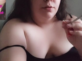 Chubby brunette smoking at home