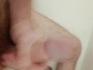 Watch me jerk my long cock in the shower and cum hard.