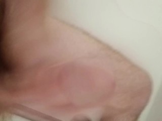 Watch me jerk my long cock in the shower and cum hard.