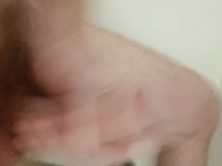 Watch me jerk my long cock in the shower and cum hard.