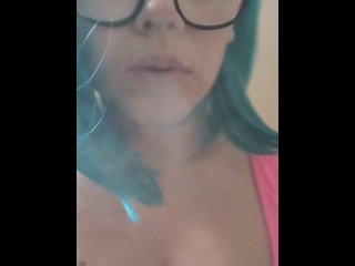 Nerdy girl with glasses vapes