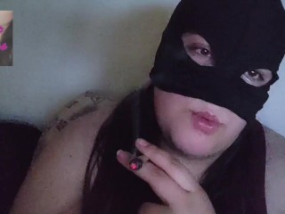 Masked chubby smokes in bed